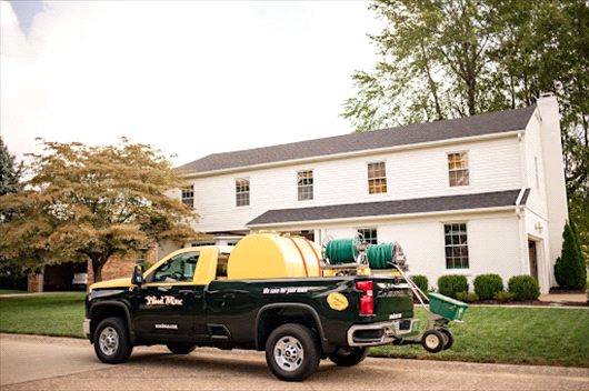 Weed Man truck in front of lawn